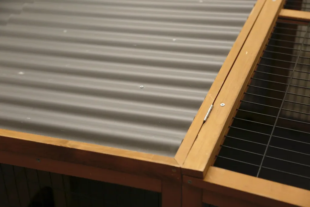 Outdoor enclosure with plastic roof & escape barrier