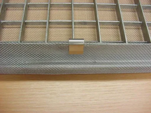 Dirt and small animal deflectors for light shafts, fiberglass fabric