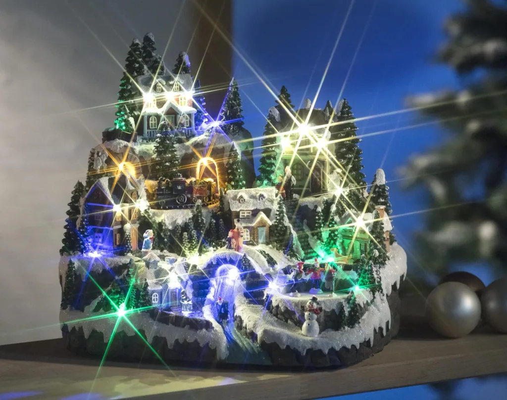 Christmas village scene with lighting and music