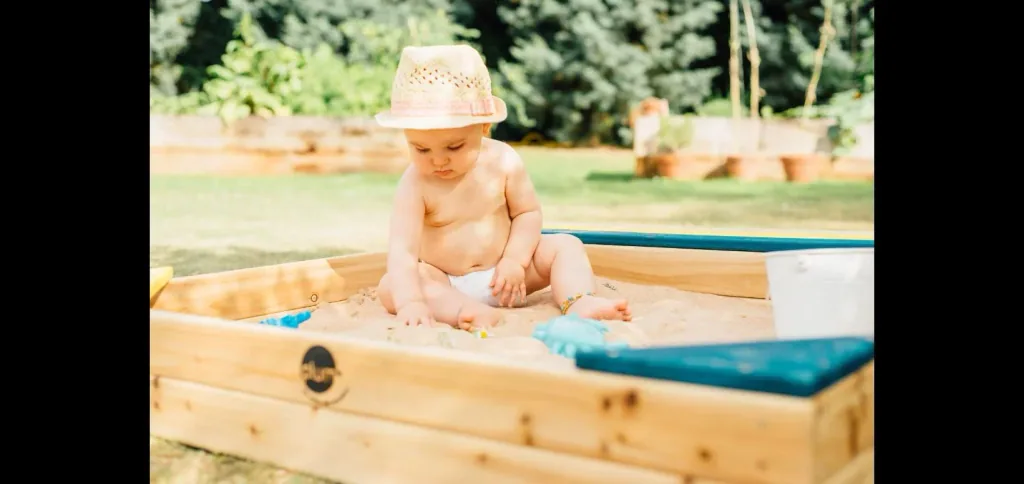 Wooden sandpit with storage box, outdoor sandpit for children made of wood, bench, seating area, colorful