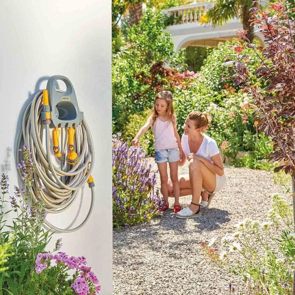 Wall hose holder with 20m garden hose, coupling and garden sprayer