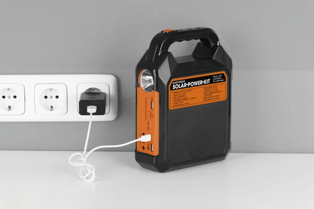 Solar generator kit with its own solar panel, radio and speaker, 10000mAh black/orange