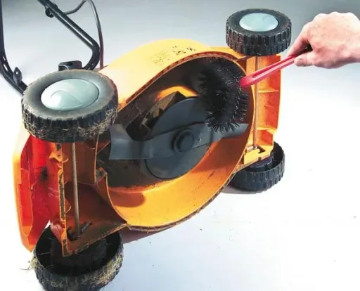 Lawnmower cleaning brush