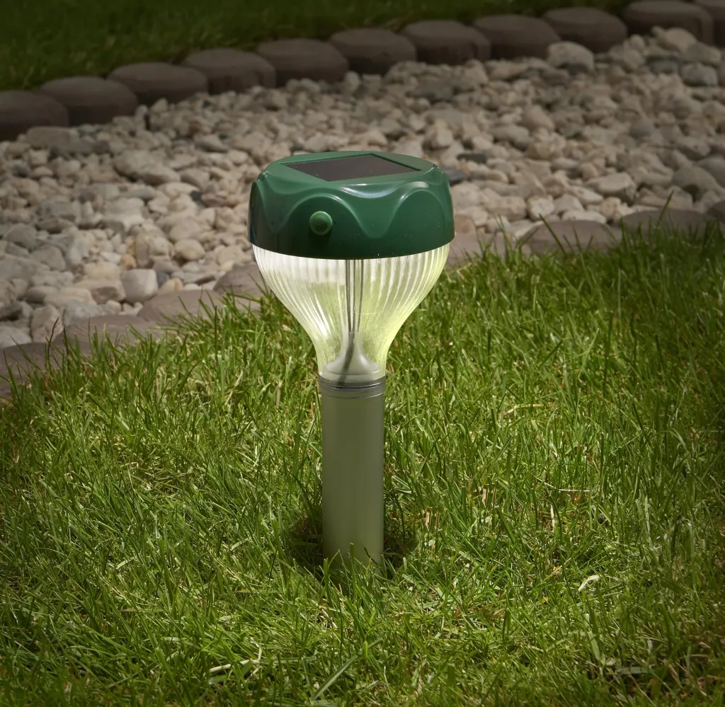 Solar-powered burrowing animal repeller including lighting 2-in-1