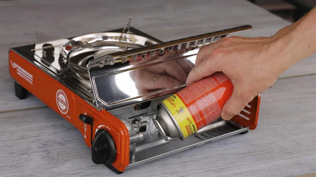 Compact gas table cooker Deluxe RS 220 with integrated cartridge compartment