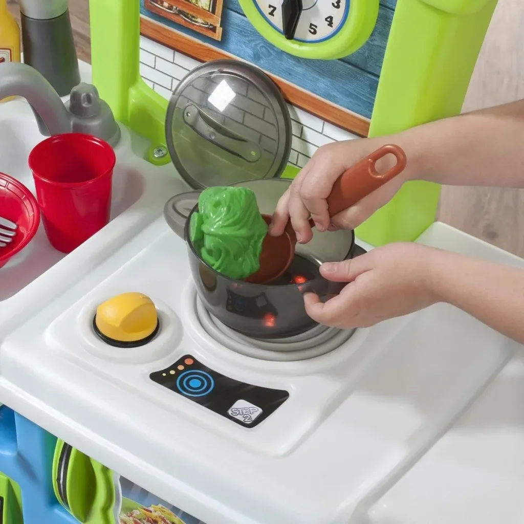 Little Cooks Kitchen play kitchen including 21-piece accessory set