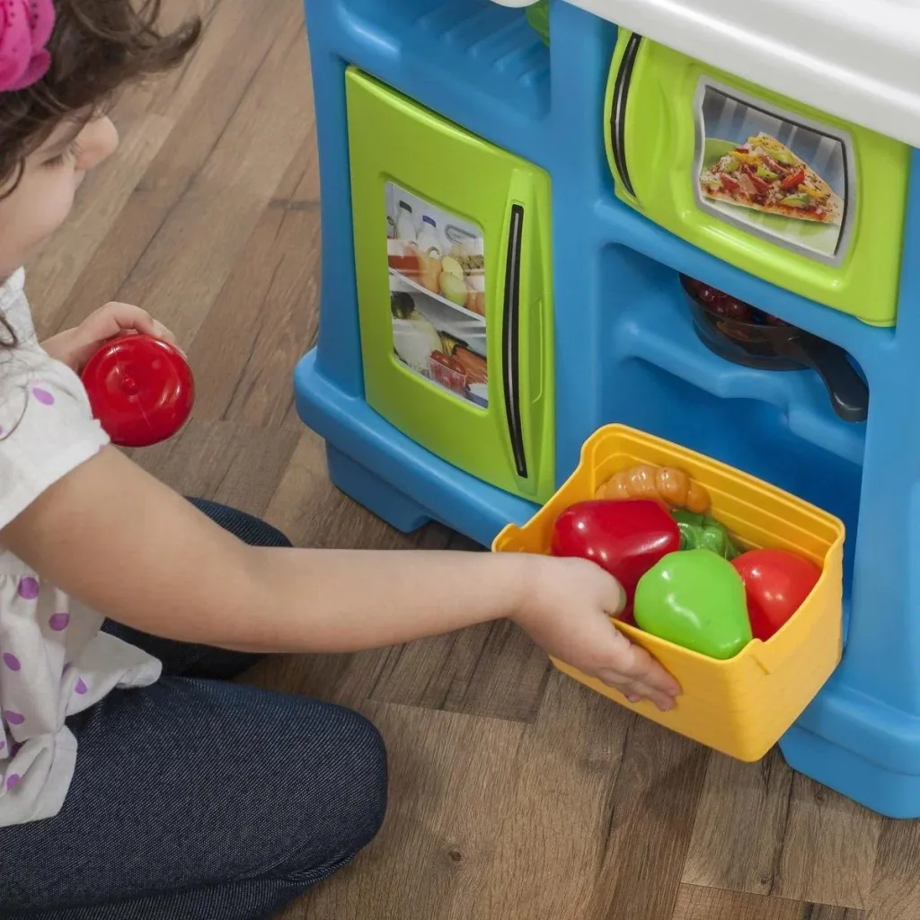 Little Cooks Kitchen play kitchen including 21-piece accessory set