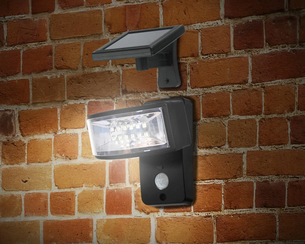 LED wall light with separate solar panel and motion detector