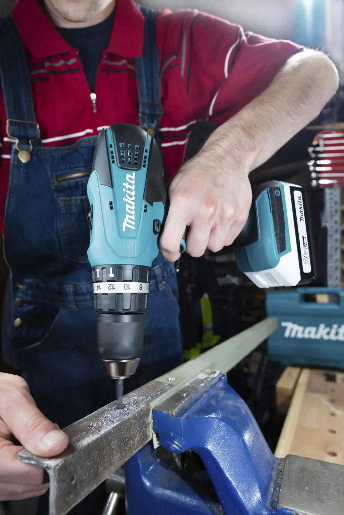 Cordless impact drill HP457DWE10, 18 Volt - 2-speed, Li-Ion with 74-piece accessories