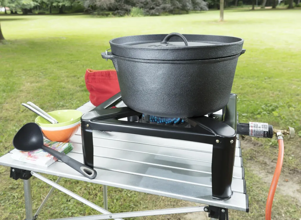 Stool cooker including hose and regulator