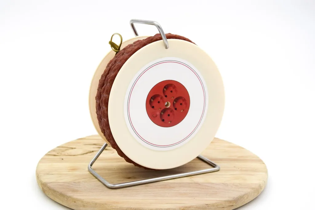 Snack sausage on cable drum
