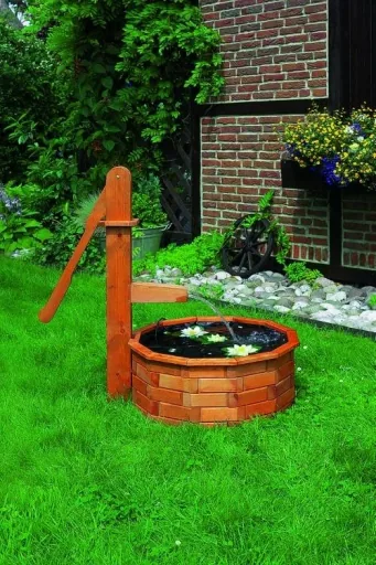Wooden trough round as a water feature solar