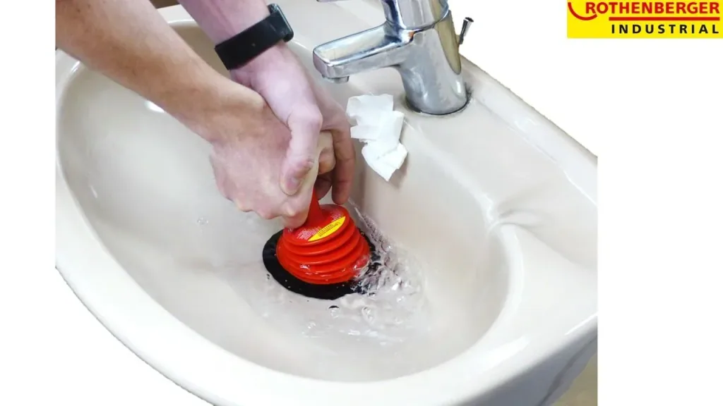 Drain cleaner, plunger for clogged drains, color-sorted