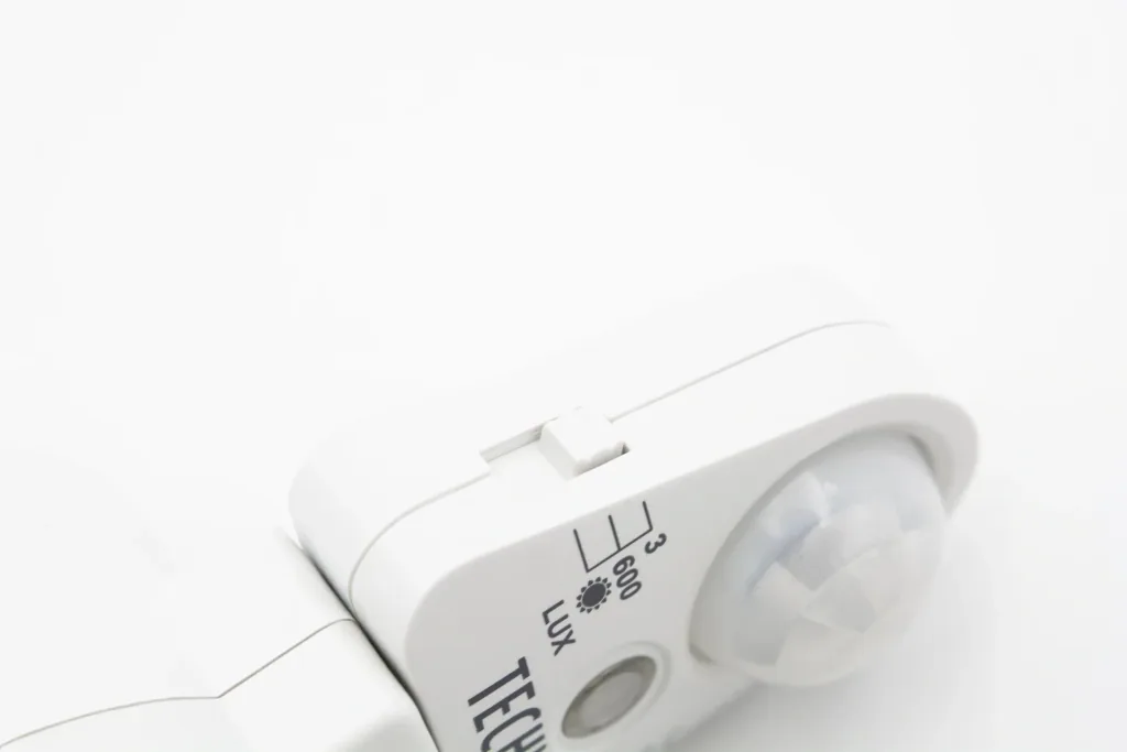 Socket adapter with motion detector and light sensor