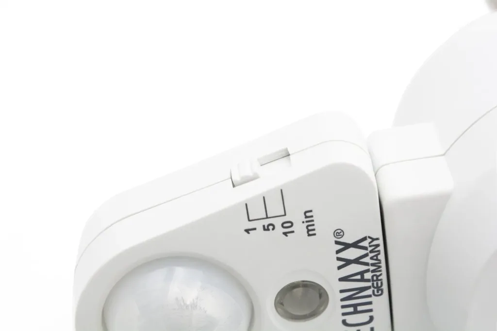 Socket adapter with motion detector and light sensor