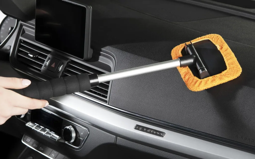 Car window interior cleaner including spray bottle and microfiber cover