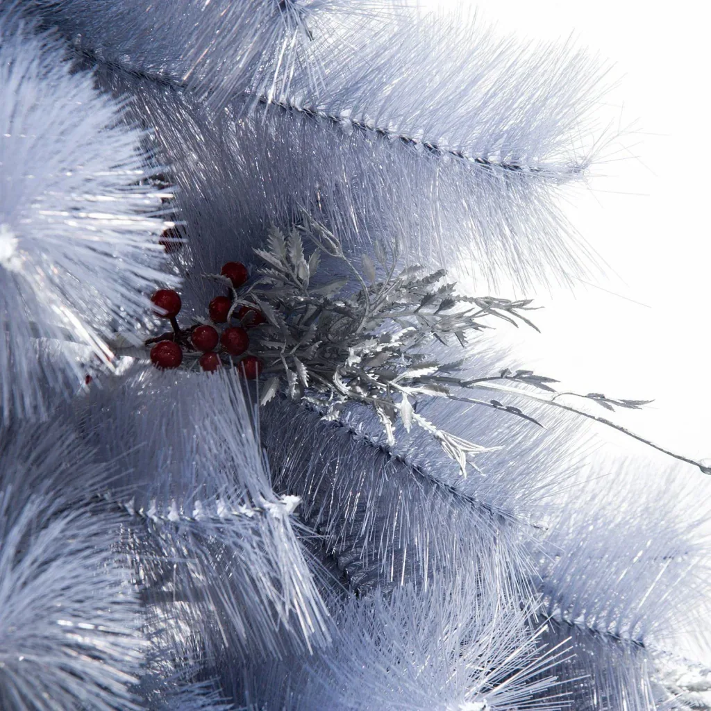 Artificial Christmas tree with silver branches and red berries