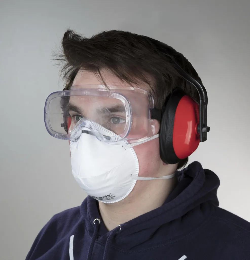 Coarse dust mask including safety goggles and hearing protection