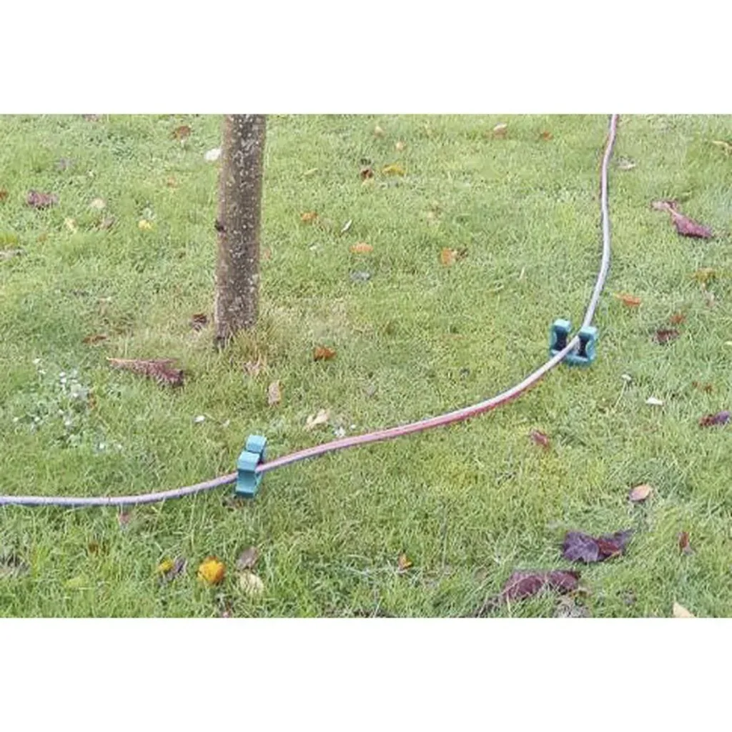 Garden hose holder/garden hose guide
