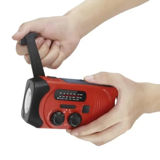 Portable solar crank radio with flashlight