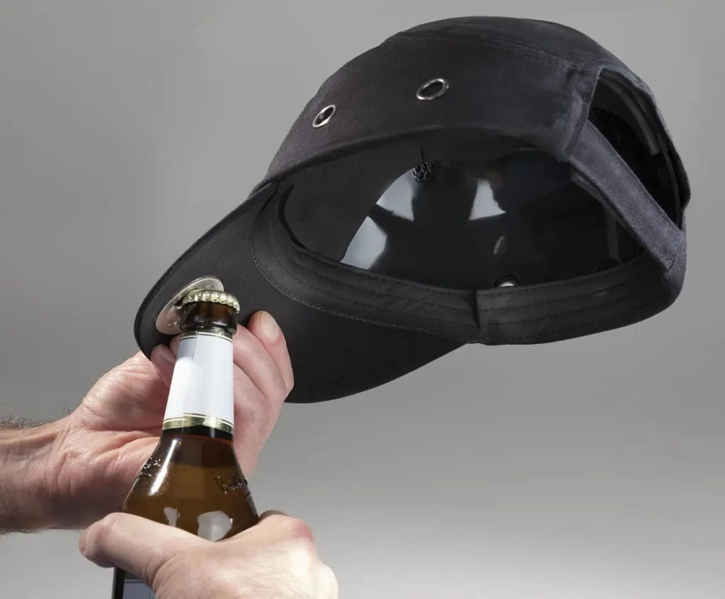 Black safety cap with integrated bottle opener